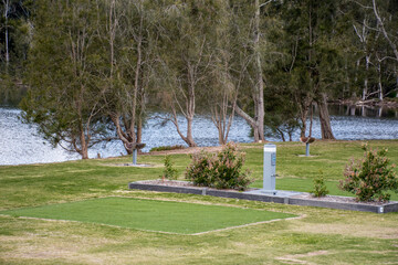 Obraz premium Empty powered camping site for caravans. camper trailers and motorhomes at the caravan holiday park on the lake