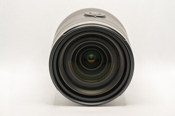 photographic lens lying down when viewed from the front with white background