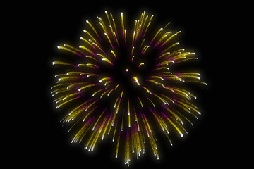 Multi-color festive fireworks isolated on a dark background. 3D rendering firework decorated celebration. A shower of confetti explosion ilustration. Realistic anniversary bursting fireworks display.