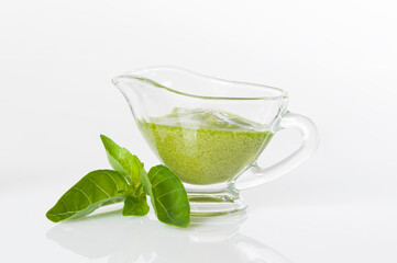 Delicious, fresh pesto sauce made with basil, olive oil, garlic and pine nuts. Green pesto sauce in...
