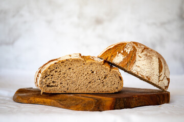 Sliced rye bread on cutting board closeup