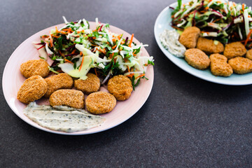 vegan nuggets with shredded salad and dairy-free sauces, healthy plant-based food