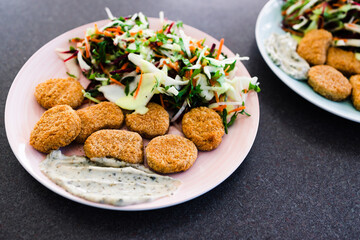 vegan nuggets with shredded salad and dairy-free sauces, healthy plant-based food