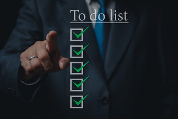 Business man point to to do list, check list for business strategy