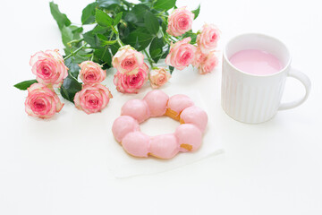 Obraz na płótnie Canvas pink concept. donut, drink and rose