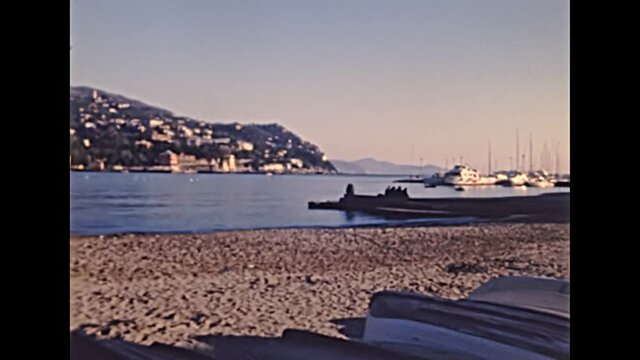 panorama of city port and Vittorio Veneto waterfront of Rapallo town with Rapallo Castle. Archival of Italy in 1980s of Rapallo city in Liguria region of Italy in 1987.