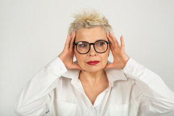 beautiful adult woman in glasses on a white background 