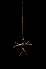 Wooden symbol of tree branches islated on black background. Ancient occult symbols. Occultism and...