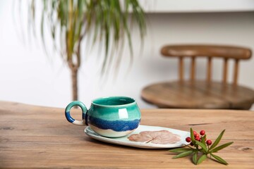 colorful handmade ceramic coffee mug on white