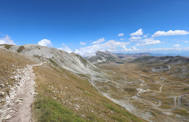 wide valley in the Italian Abruzzi region of the Gran Sasso massif in central Italy in summer
