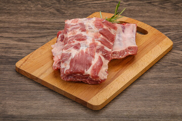 Raw pork ribs served rosemary