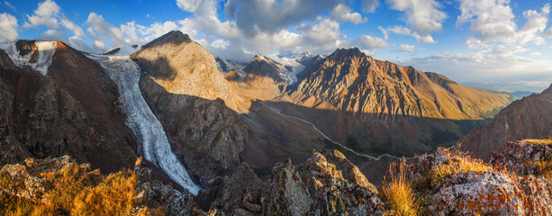 Panorama of Altai Mountains in morning light, rocky peaks and glaciers	