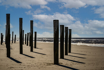 Wooden poles village along the beach of Petten, Netherlands.