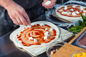 Margherita Pizza being made at food market, close up.