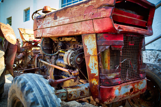 Image of the engine of an old tractor for harvesting grapes at a winery.