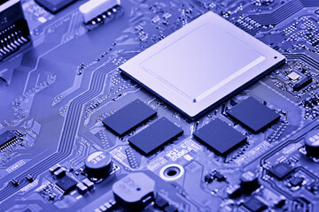  Part of the main circuit board close-up. Light blue tinted background or wallpaper on the theme of electronic