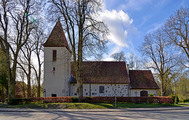 Fototapeta na wymiar Currently erected in the 16th century, the Catholic Church of Saint Józef Rzemielnik in Nakomiady in Masuria, Poland. The photos show a general view of the temple.