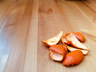 Orange peel on wooden pine table
