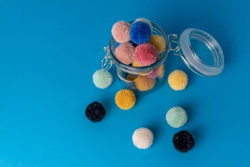 Fotobehang creative crafts using wool and yarn pompoms  © MW Photography 