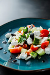 Delicious healthy dietary fresh salad with fresh vegetables, herbs, olive oil. Healthy Diet Snack