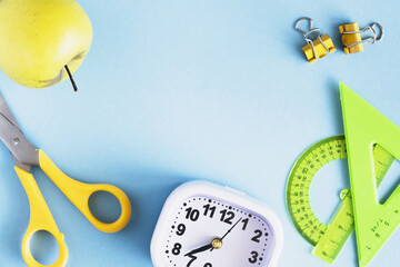 School layout. Stationery on a blue bright background. Back to school. Frame with place for text.