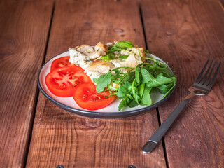 Healthy dietary breakfast of vegetables and eggs, cauliflower baked in a pan