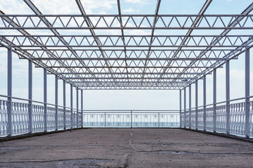 Metal construction on the pier by the sea.