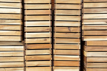Empty Wooden Boxes Containers Crates for harvest. Stacked storage  boxes from wood on row. Background