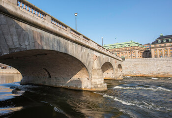 Spring flood in Stockholm passing the bridges and parterres between government houses and the Royal Opera