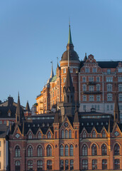 View over old houses in the Södermalm district a spring day at sunrise in Stockholm from the Riddarholmen island
