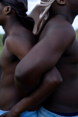 Fototapeta premium closeup of young african men standing back to back