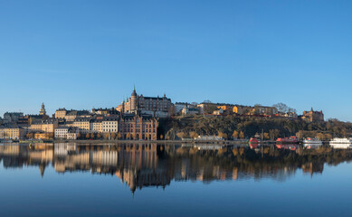 View over old houses in the Södermalm district a spring day at sunrise in Stockholm from the Riddarholmen island
