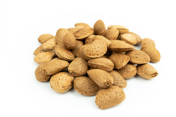 bunch of shelled almonds on a white background