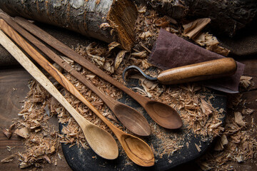 wooden spoon carver at work with hand tools