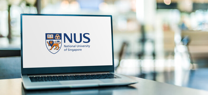 Laptop computer displaying logo of NUS