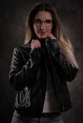 Attractive young woman poses for the camera - studio photography