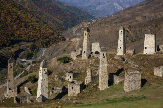Landscape autumn view of medieval ancient stone battle tower complex in the mountains of Ingushetia, Russia