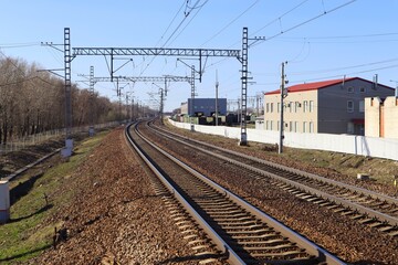 railway station, railroad, electric wires,  sunny day, blue sky