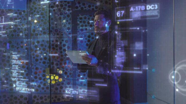 Adult Businessman in Office Standing by Infographics Screen Examining Corporate Business Data on Futuristic Interactive Hologram Technology at Office. AI Concept.