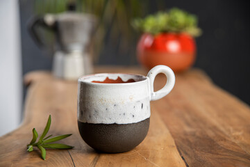 coffee with colorful ceramic mug on wooden table