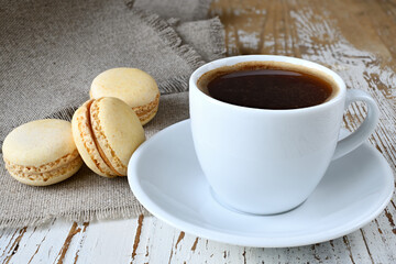 Still life with a cup of coffee and makroons