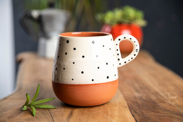 coffee with colorful ceramic mug on wooden table