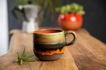 coffee with colorful mug on wooden table