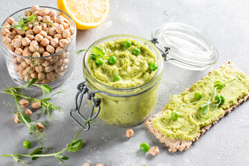 Healthy avocado hummus and green pea with olive oil. Vegetarian concept