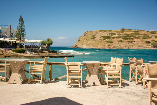 Beautiful shot of an outdoor cafe near the shore in Greece