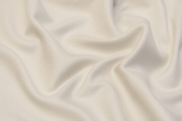 The texture of cashmere fabric beige. Background, pattern.