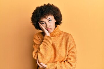 Fototapeta na wymiar Young hispanic girl wearing wool winter sweater thinking looking tired and bored with depression problems with crossed arms.