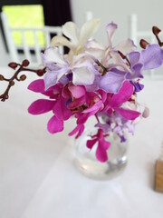 colorful orchids bouquet in the glass vest design for elegant lifestyle