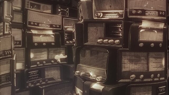 Vintage Old Radio Pile Flickering Lights. Pile of vintage old radios flickering lights spinning around. Film damage filter