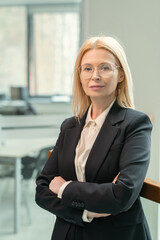 Portrait of confident female executive crossing arms